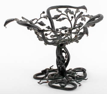 Umberto Bellotto Wrought Iron Stand: Umberto Bellotto (Italian, 1882-1940) wrought iron stand in the form of holly tree branches and three serpentine snakes, apparently unsigned, circa 1915. 9.5" H x 14" diameter. Provenance: Property fr