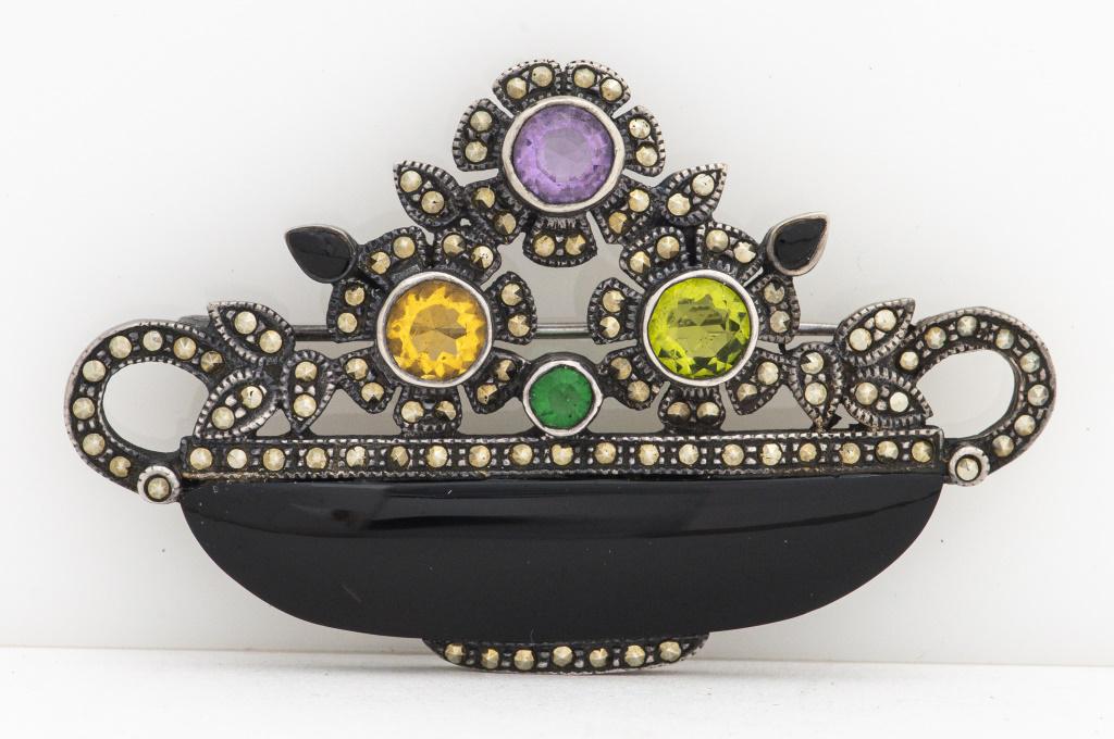 Silver Amethyst, Onyx, Glass & Marcasite Brooch: Vintage sterling silver amethyst, onyx, colored glass and marcasite floral boutique brooch / pin, marked: "925". Brooch measures: 2.43"L 1.50"W. Approx: 0.62 ozt. inclusive.