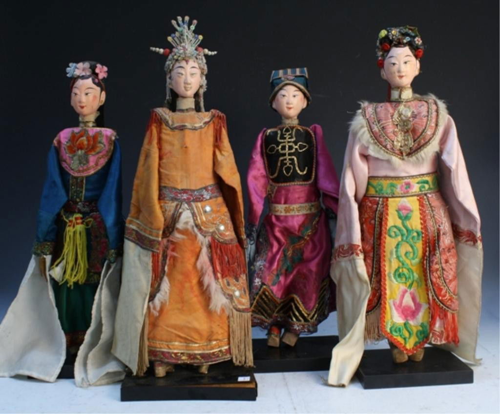 Chinese Opera Puppet Dolls Lot of 4: Lot of 4 Chinese Opera puppet dolls, each wearing different costumes: robes range from pink, dark blue, orange and purple, all wear headpieces, China; unmarked. Dimensions: Blue robe: 19" L (with base
