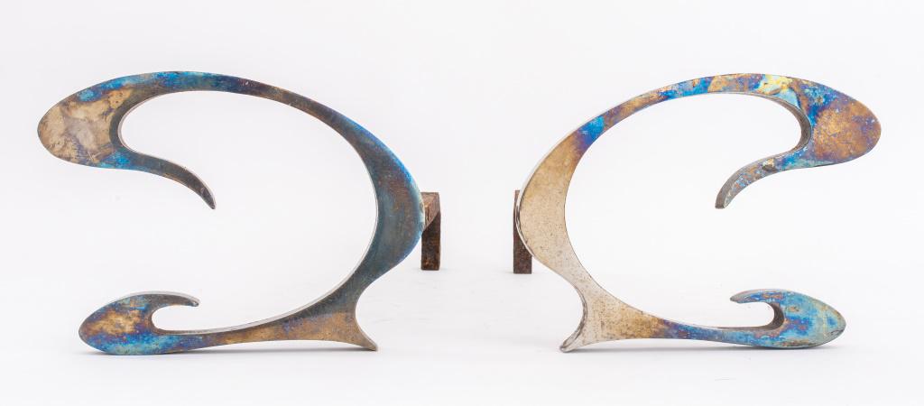 Jean-Paul Creations Stainless Steel Andirons: Pair of French Jean-Paul Creations stainless steel andirons or 'chenets', having Art Nouveau form, circa 1970s. 7.25" H x 9.75" W x 16.25" D.
