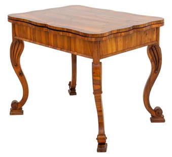 Biedermeier Walnut Extending Table, 1840s: Unusual late Biedermeier table in the manner of Josef Danhauser (Austrian, 1805-1845), the bookmatched walnut veneered top with early rococo revival manner shaped edges above a rectangular top with sc