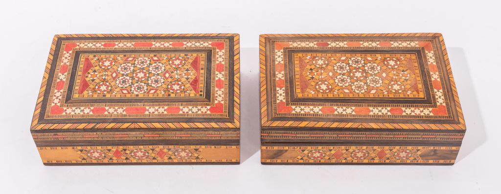 Syrian Inlaid Wooden Decorative Boxes, Pair: Syrian inlaid wooden decorative boxes, comprising of different colors of dyed wood, lined with red velvet, unmarked. 2" H x 6.75" W x 4.5" D.