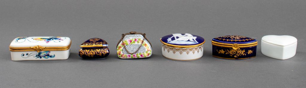 Limoges Porcelain Trinket Box, 6: Group of six Limoges porcelain trinket / decorative boxes in various shape, made in France, each signed to underside, one with small chip to lid. Largest: 1" H x 2.75" Diameter.