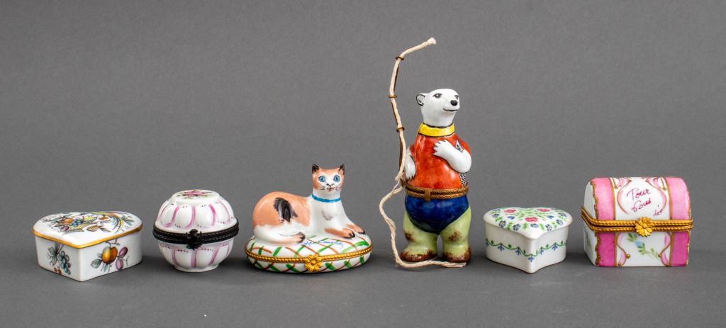 Limoges Porcelain Trinket Box, 6: Group of six Limoges porcelain trinket / decorative boxes in various shape, made in France, each signed to underside, one with small chip to lid. Largest: 4.5" H x 1.5" W x 1.75" D.