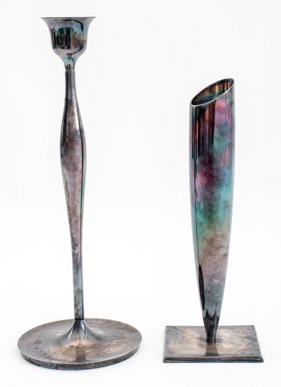 Swid Powell Silver Plated Candlestick, 2: Group of two Swid Powell silver plated candle holders comprising one candlestick designed by Elsa Rady (American, 1943-2011), each with maker marks to underside. Largest: 12.5" H x 4.75" Diameter.
