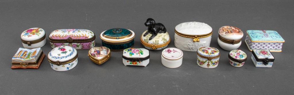 Porcelain Diminutive Decorative Boxes, 15: Group of fifteen diminutive porcelain boxes, including one Royal Copenhagen, and one Royal Doulton in the "Biltmore" pattern, twelve have either no marks or spurious marks. Largest: 1.25" H x 3" W x 2