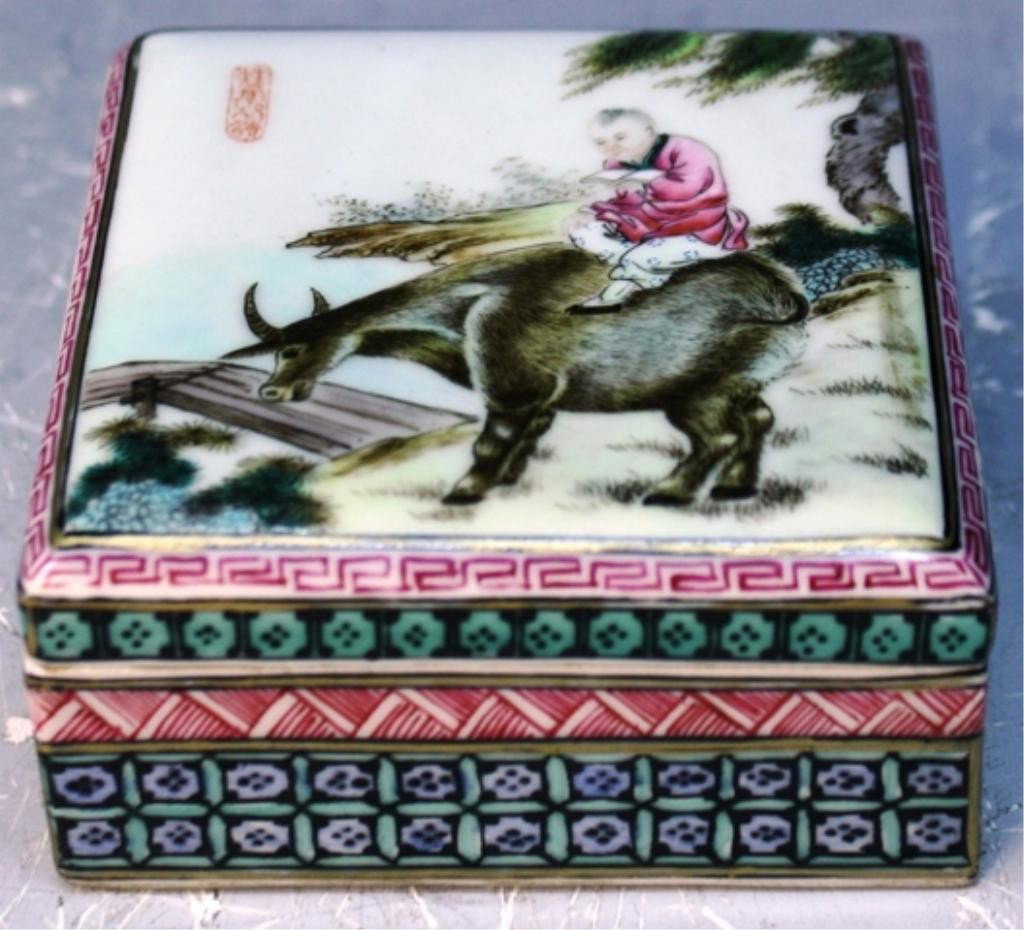 Chinese Porcelain Famille Rose Box Yongzheng Mark: Famille rose glazed porcelain ink box with figure riding an ox, China; Yongzheng mark. Dimensions: 1-5/8"H x 3-3/8"W x3-3/8"D