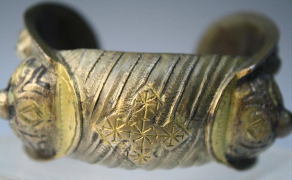 Byzantine Metal Bracelet with Enamel Traces: Bracelet with repousse designs, metal with traces of enamel, Byzantine Empire; unmarked. Dimensions: approximately 1-3/8"H x 2-1/2"W x 2-1/4"D