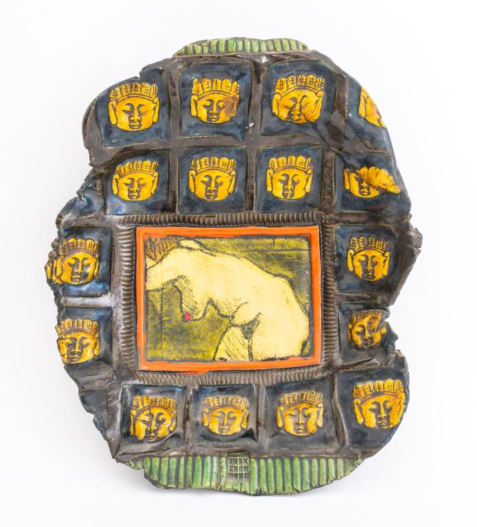 Erik Gronborg Glazed Earthenware Wall Sculpture: Erik Gronborg (Danish-American, b. 1931) polychrome glazed earthenware wall sculpture or freeform centerpiece depicting a nude woman surrounded by Buddha faces, with artist stamp to bottom. 15" H x 12