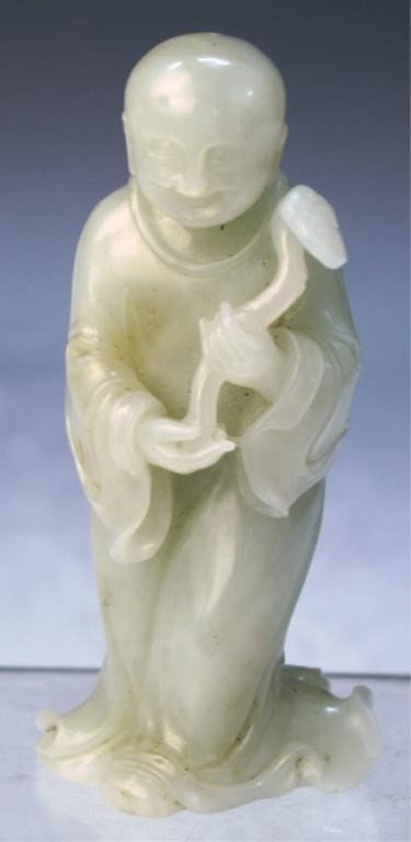 Chinese Celadon Jade Lohan 19th C: Celadon jade Lohan figure carrying a scepter, China, nineteenth century; unmarked. Dimensions: 4"H x 2"W x 1-1/4"D