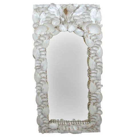 Syrie Maugham Style White Seashell Mirror c 1940s: A "white-on-white" seashell mirror, chalk white seashells mounted in plaster on a chalk white frame in the manner of Syrie Maugham, circa 1940s; unmarked. Dimensions: 4' 4"H x 27"W x 3"D