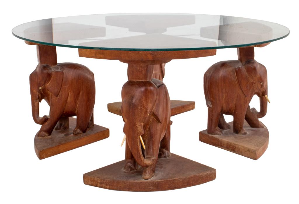 Elephant dining table store with glass top