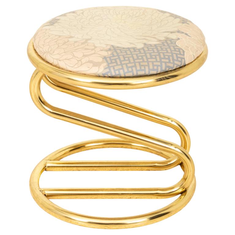Vintage Zig Zag Brass-Colored Upholstered Stool: Vintage zig zag stool, upholstered in a faux silk flower pattern on a brass-colored metal structure. 15" H x 15.5" in diameter.