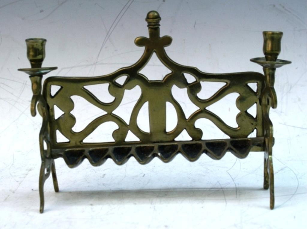 Gilded Metal Menorah with Scroll Motif: Menorah with openwork scroll motif, gilt metal; unmarked. Dimensions: 7"H x 9"W x 2-1/4"D