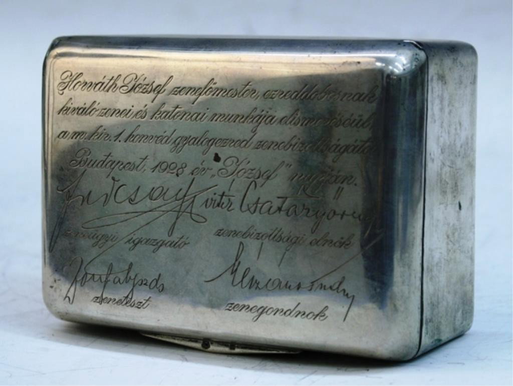 Hungarian Silver Box w/ Writing on Lid 20th C.: Silver box with Hungarian writing on lid and wooden interior, Budapest; marked and stamped on bottom. Dimensions: 2"H x 5" W x 3-5/8" D total weight with insert: 11.9 oz