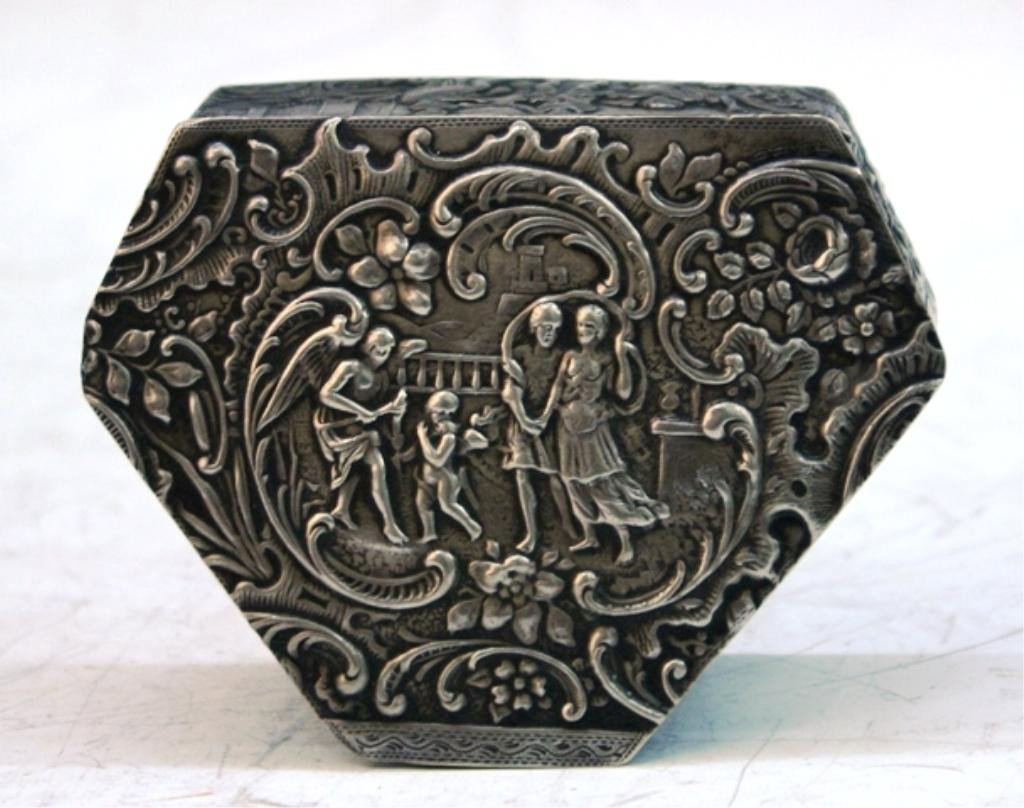 German Hanau Silver Hexagonal Box w/ Figures: JD Schleissner & Sohne Hanau silver hexagonal box with figural scenes and scrolling designs with leaves and flowers, Germany; marked with JD Schleissner & Sohne maker's mark. Dimensions: 1-3/8"H x 3-1