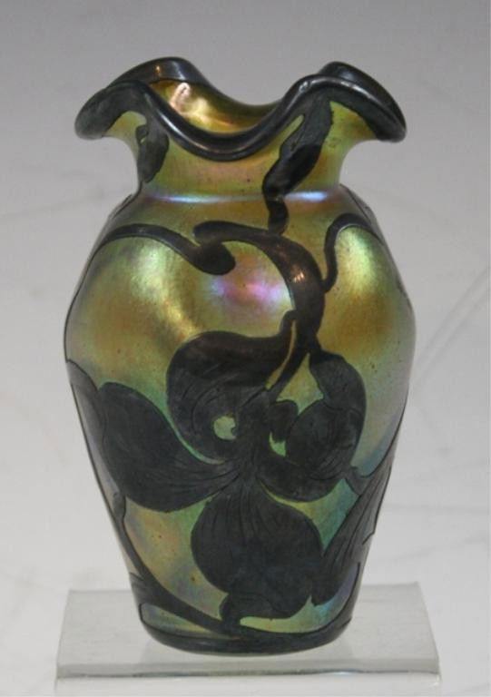 Small Art Deco Loetz Glass Vase with Metal Overlay: Small Art Deco gold iridescent Loetz glass vase with metal floral overlay; unmarked. Dimensions: 4-1/2"H x 2-1/2" diameter