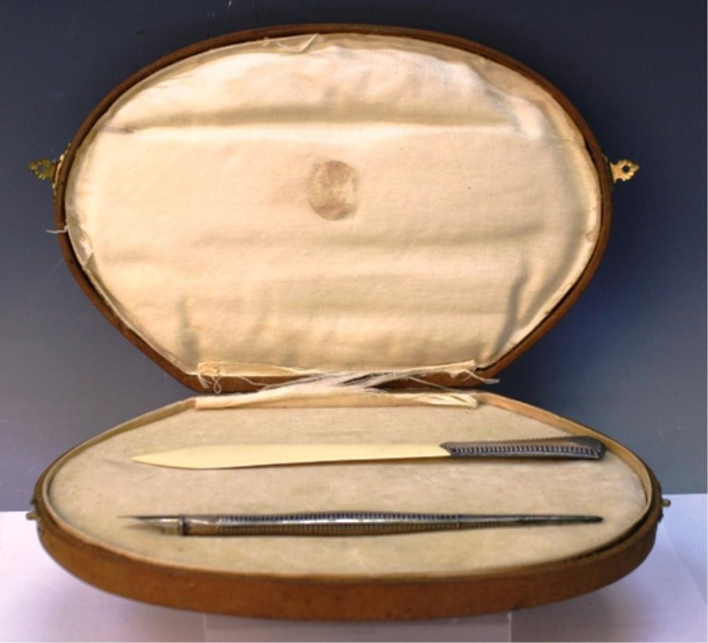 2 pc. Stationary Set w/ Pen & Letter Opener: Two piece stationary set with pen and letter opener, silver; marked on silver. Dimensions: Box 5-3/4"L x 9"W x 1"D; individual sizes vary.