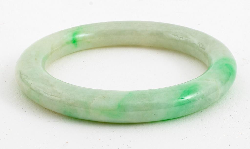 Chinese mottled white and emerald green jade small baby bangle. 2.25" diameter. Provenance: Property (1 of 5)