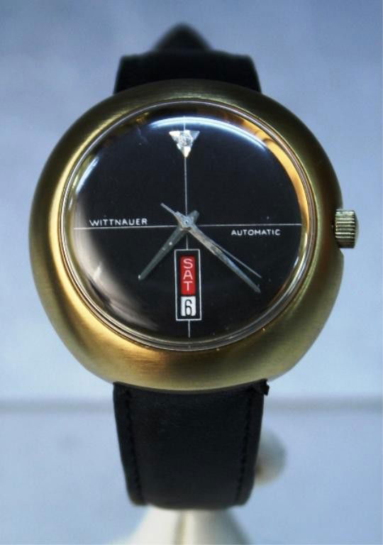 Wittnauer Longines Automatic Watch: Wittnauer Longines automatic stainless steal watch with dark brown leather strap, new old stock, United States; marked. Dimensions: 10"L; face1-5/8" diameter