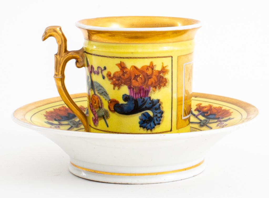 French Directoire porcelaine de Paris attributed vitrine coffee cup and saucer with Neoclassical: French Directoire porcelaine de Paris attributed vitrine coffee cup and saucer with Neoclassical motif on yellow and gilt ground, apparently unsigned, circa late 1790s. Overall: 3.25" H x 5" diameter.