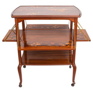 Louis Majorelle Art Nouveau Marquetry Tea Cart: Louis Majorelle (French, 1859-1926) Art Nouveau marquetry mahogany tiered tea cart, circa 1890, the shaped rectangular top inlaid with a floral landscape in the Japonaisme taste, and with inlaid signa