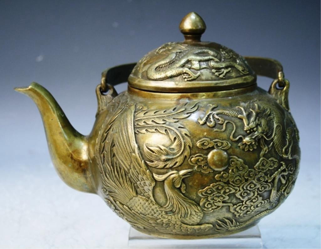 Chinese Metal Teapot w/ Dragons & Phoenix: Metal teapot with dragons and phoenix in relief, China; marked. Dimensions: 9-1/2"H x 8-3/4"W x 6-1/2"D
