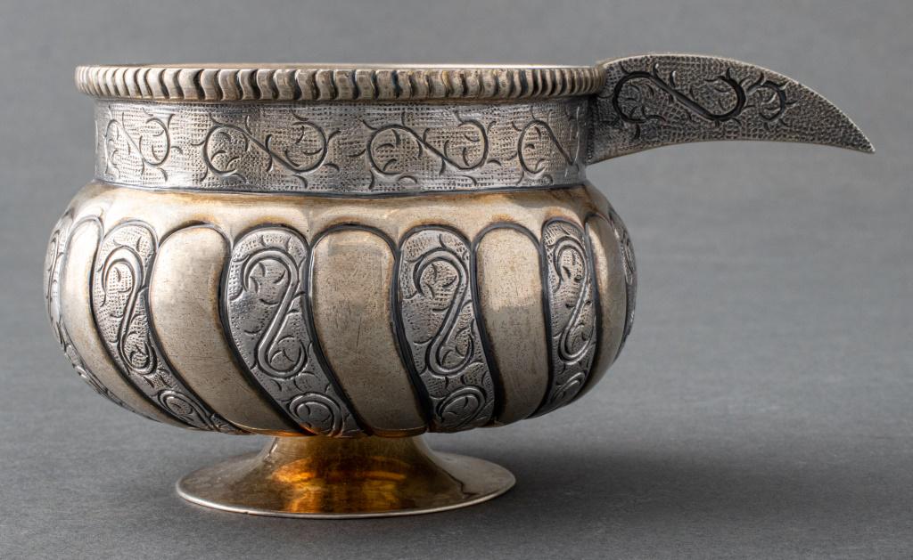 Tane Mexican Silver and Parcel Gilt Lobed Cup: Tane Mexican sterling silver and parcel-gilt lobed cup, struck "TANE / Hecho en Mexico / Sterling / ROM" and other marks to underside, the footed cup with alternating diagonal gilt-washed and engraved
