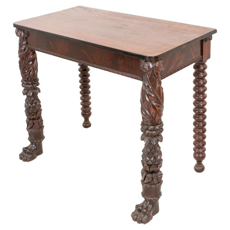 Anglo Caribbean Mahogany Pier Table, 19th C.: Anglo Caribbean mahogany wood pier table, nineteenth century, the top rounded rectangular above exuberantly carved front legs ornamented with pineapples and baskets of fruit above lion's paw feet, wit