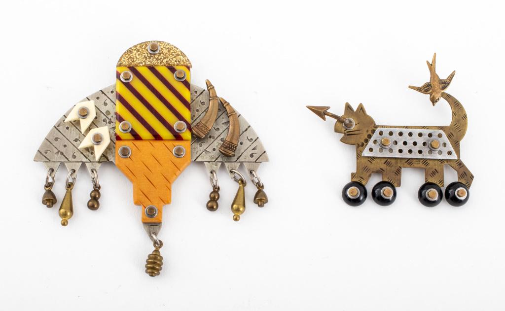Thomas Mann Mixed Metal Brooches, 2: Two Thomas (Tom) Mann (American, b. 1947) pins, one in mixed metals mounted with resin in the form of a stylized bee insect, marked "HANDWROUGHT" with maker's mark, signed, and dated 1988 to reverse,