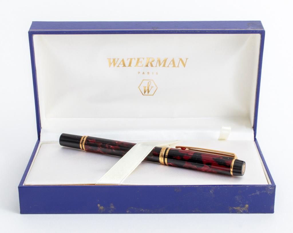 Waterman Raspberry Marbled Fountain Pen: Waterman fountain pen, 2nd half of the 20th century, 18 K yellow gold Ideal nib, raspberry marbled case, gilded applications, made in France. 5.5" H x 0.5" Diameter.