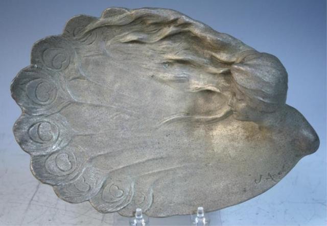 Metal Dish w/ Woman's Face signed J. Angles French: Decorative dish with a woman's face and peacock feathers, metal, poss. French, c. 1900; marked. Dimensions: 11"L x 7-1/2"W x 3"H