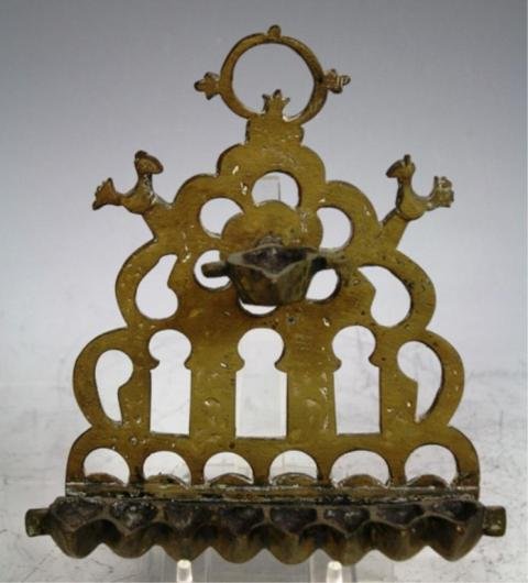 Bronze Tunisian Menorah 19th Cent.: Menorah with birds on either side, bronze, Tunisia, nineteenth century; unmarked. Dimensions: 8-1/2"H x 7-1/2"W x 2"D