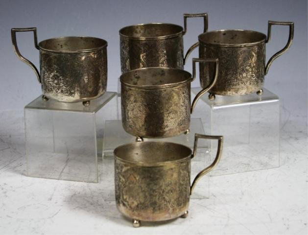 Set of 5 Persian Silver Cup Holders: Set of five silver tea cup holders with engraved design, Persia; marked on bottom. Dimensions: 3"H x 4"W x 2-1/2" diameter overall weight: 18.3 oz