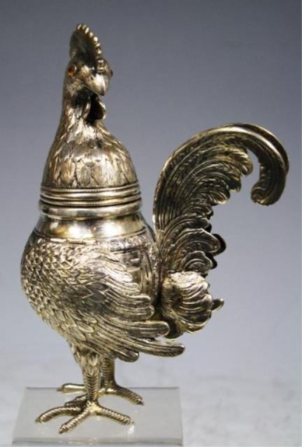 Silver Chicken with Inlaid Eyes poss. German: Silver chicken with inlaid eyes, head detaches to reveal storage compartment, possibly German; unmarked. Dimensions: 7-1/2"H x 3"W x 5"D weight: 13.5 oz