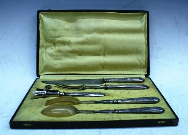 5pc. Set of French Decorative Silverware: Five piece set of decorative silverware, France; marked "Paris" on silver. Dimensions: spoon: 11"L x 1-3/4"W; fork: 11"L x 1"W; nutcracker: 7-1/2"L x 2"W; all silver fork: 10-1/2"L x 1"W; knife: 12-1/