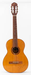 Carlos Santana Autographed Giannini Guitar: Carlos Santana (Mexican/American, b. 1947) signed Giannini 1900 Serie Estudo classical acoustic guitar. 38" H x 13.5" W x 3.5" D.