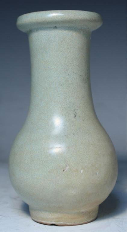Chinese Celadon Glazed Vase: Celadon glazed ceramic bottle vase with crackle pattern, China; unmarked. Dimensions: 6"H x 3-1/4" diameter