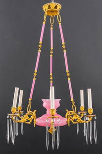 Gilt Bronze & Pink Milk Glass 6 Arm Chandelier: Gilt bronze and pink milk glass six-armed chandelier with scrolling foliate ormolu arms terminating in pink cloth shades. 32" H x 28" diameter. Provenance: Property from an Upper East Side townhouse.