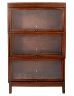 Globe Wernicke Walnut Bookcase: Globe Wernicke walnut wood bookcase with three glass-front compartments, "GENUINE AMERICAN WALNUT" labels inside. 55.5" H x 34.5" W x 11.5" D. Note: This item is only available for preview at our Asto