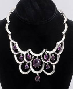 Pineda Sterling & Amethyst Bib Necklace: Vintage Taxco Pineda sterling silver ten amethyst cabochon drop necklace with curved link design and box clasp closure with set amethyst button, approx. 42 carats amethyst total weight, signed "MGI" w