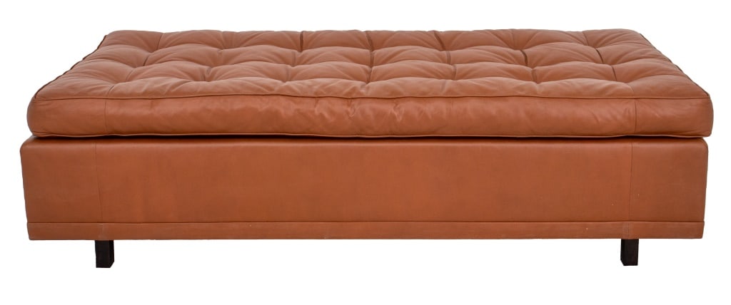 Thad Hayes Designed Daybed, 1990s: Thad Hayes (American, XX-XXI) uniquely designed daybed, executed by Kenny Flam, 1990s, with buttoned cognac leather top above a conforming base on ebonized square legs. 24" H x 80" W x 39" D. Provenan