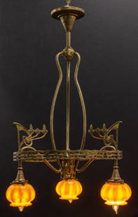 Austrian Art Nouveau Quezal Shaded Chandelier: Austrian Art Nouveau three-armed brass chandelier, circa 1900, the stylized, pierced Jugendstil / Art Nouveau manner frame with three pendants holding globular Quezal iridescent glass shades with pull