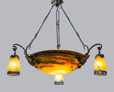Muller Freres French Art Nouveau Chandelier: Muller Freres French Art Nouveau chandelier, circa 1900-1910, the iron armature with a central reverse art glass dome and three glass pendant shades suspended from grape vine mounts, the shades of mot