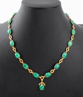 14K Yellow Gold Jade Necklace: 14K yellow gold necklace, featuring 15 oval jade cabochons weighing a total of approx. 100.00 carats, joined with fold-over hook and eye clasp, marked: "EB 14K". Measuring approx. 18" x 1" across wide