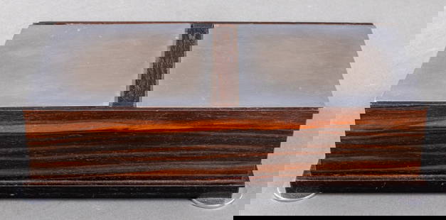Art Deco Chrome & Macassar Wood Table Box: Art Deco period macassar wood table box with ebonized wood border and two chrome metal hinged lids and four disc feet. 2.5" H x 10.25" W x 5.5" W. Provenance: From a Rye, N.Y. collection.