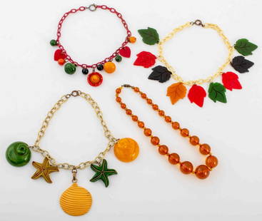 Vintage Multi-Color Bakelite Necklaces, 4: Group jewelry lot of four vintage Bakelite necklaces comprising one graduated clear orange amber resin Bakelite bead necklace, one with multicolor pendants including heart and hat forms in cherry red