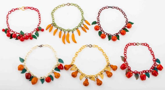 Vintage Multi-Color Bakelite Fruit Necklaces, 6: Group jewelry lot of six vintage Bakelite mixed fruit form necklaces comprising one with red cherries, one with butterscotch orange Bakelite pears, one with carved orange beads, one with yellow banana