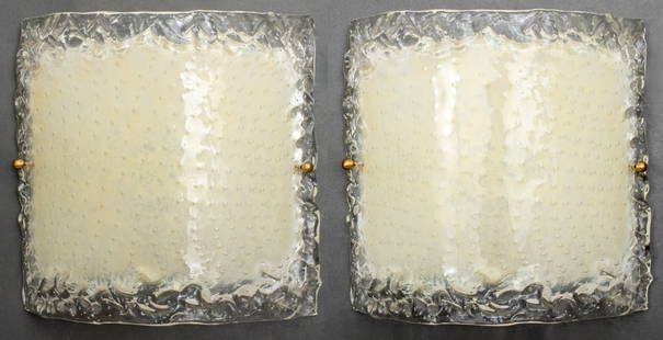 Swedish Modern Art Glass Wall Sconces, Pair: Pair of Swedish Modern art glass wall sconces, the clear glass shades with controlled bubble design within textured border, the inside hand-painted in a warm butter yellow hue. 12.75" H x 12.75" W x 3