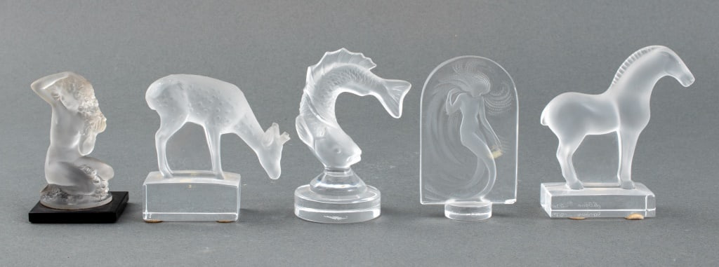 Lalique Glass Animals & Nude Women Sculptures, 5: Five Lalique France sculptures comprising one horse, one "Daim" (deer), one fish, and two figurines of nude women, all marked "Lalique / France." 4" H x 2" diameter.